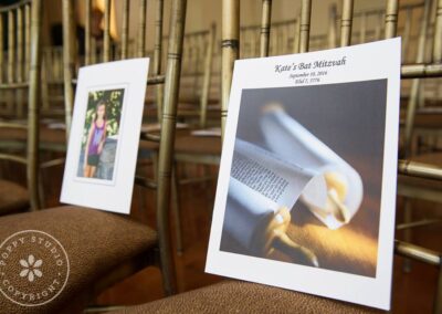 Two decorative cards at a Bat Mitzvah ceremony in a synagogue.